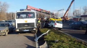 Груженый "КамАЗ" столкнулся с Lada и перевернулся в Алматы 