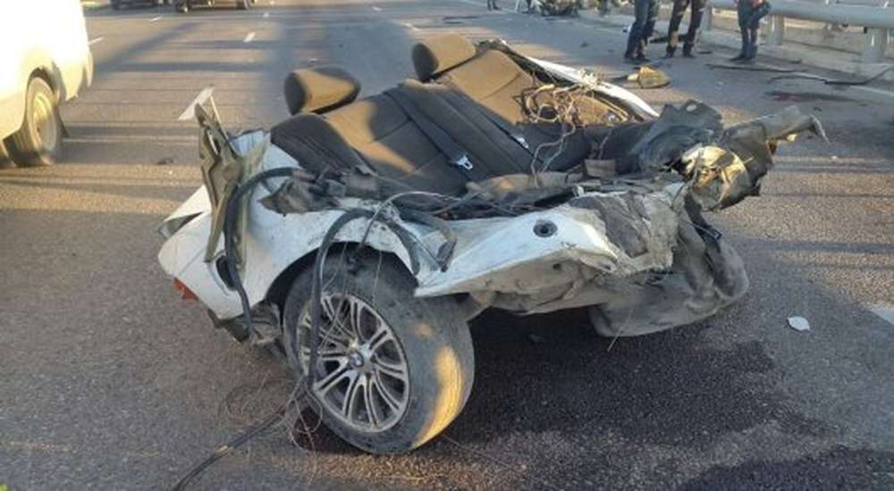 BMW разорвало пополам в ДТП в Алматы